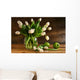 White tulips in glass vase on rustic wood Wall Mural