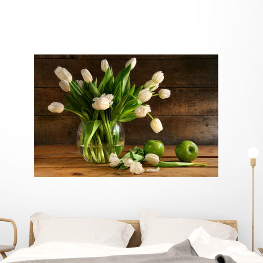 White tulips in glass vase on rustic wood Wall Mural