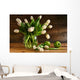 White tulips in glass vase on rustic wood Wall Mural
