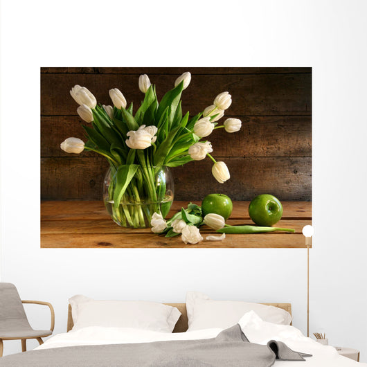 White tulips in glass vase on rustic wood Wall Mural