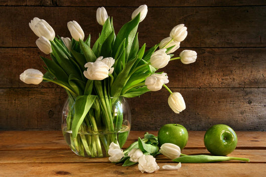 White tulips in glass vase on rustic wood Wall Mural
