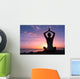Young healthy woman practicing yoga on the beach at sunset

 Wall Mural