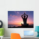 Young healthy woman practicing yoga on the beach at sunset

 Wall Mural