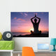 Young healthy woman practicing yoga on the beach at sunset

 Wall Mural