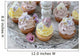 Purple and yellow cupcakes with sugared edible flowers on vintage cake stand Wall Mural