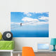 Man climbing on the suspension bridge. Wall Mural