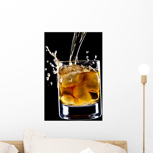 glass of whiskey and ice isolated over black background Wall Mural