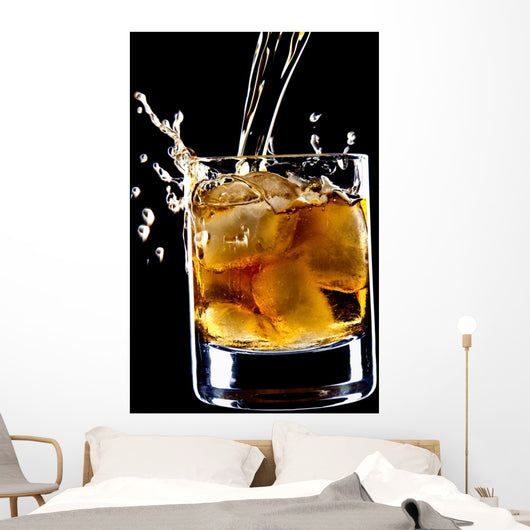 glass of whiskey and ice isolated over black background Wall Mural