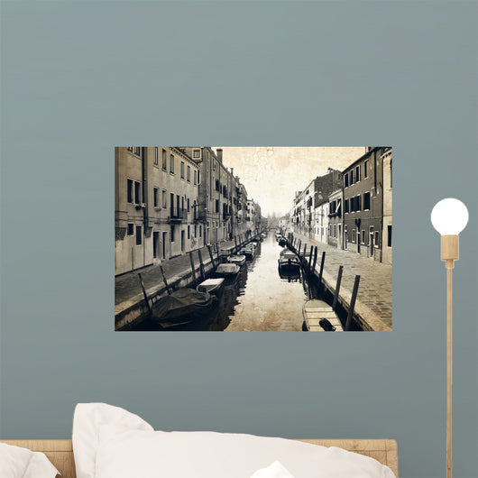 Narrow canal and embankment in Venice, Italy Wall Mural