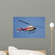 helicopter flying against a deep blue sky Wall Mural