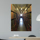 A man studying inside a library in England Wall Mural