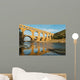 Famous Pont Du Gard reflecting in Gardon river in Southern France Wall Mural