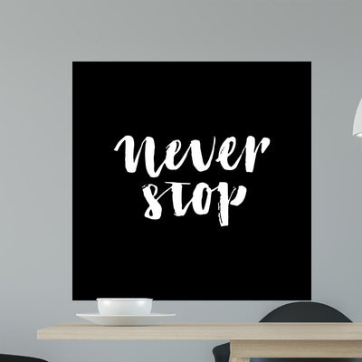 Handdrawn Lettering Phrase Never Wall Mural shown on a wall