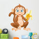 Cartoon monkey holding banana Wall Decal