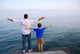 father son ocean Wall Mural
