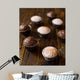 Homemade vanilla and chocolate muffins on a dark wooden table. Wall Mural