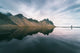 Landscape with mountains reflected in water, Iceland Wall Mural