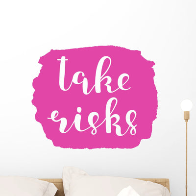 Take Risks Brush Lettering Wall Decal shown on a wall