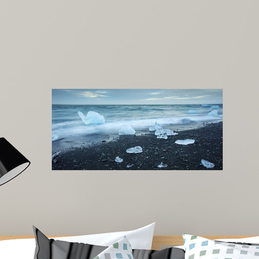 floated iceberg  on the lava beach Wall Mural