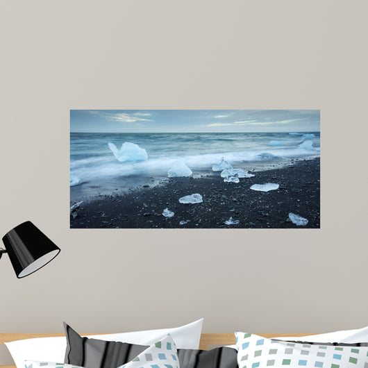 floated iceberg  on the lava beach Wall Mural
