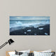 floated iceberg  on the lava beach Wall Mural