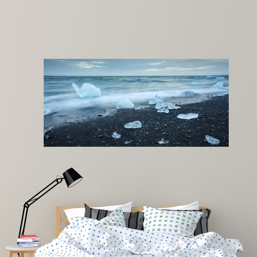 floated iceberg  on the lava beach Wall Mural