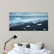 floated iceberg  on the lava beach Wall Mural