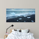 floated iceberg  on the lava beach Wall Mural