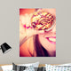 Funny woman holds cake in hand covering her eye Wall Mural