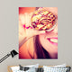 Funny woman holds cake in hand covering her eye Wall Mural
