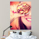 Funny woman holds cake in hand covering her eye Wall Mural