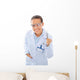 A young dentist with a tool on a white background Wall Decal