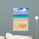 Drawing connected hearts on beach Wall Mural