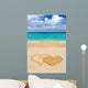 Drawing connected hearts on beach Wall Mural