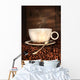White coffee cup with spoon on roasted beans Wall Mural