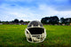 American Football Helmet in Grass Wall Mural