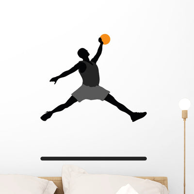 Basketball Player Silhouette Wall Decal shown on a wall