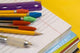 School Supplies on Yellow Background Wall Mural