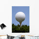 golf ball on tee on grass Wall Mural