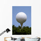 golf ball on tee on grass Wall Mural