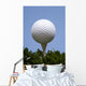 golf ball on tee on grass Wall Mural