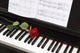 sheet music with rose on piano Wall Mural