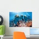 three dolphins close up portrait underwater while looking at you Wall Mural