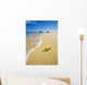 plumeria blossoms lie on white sand by the tropical pacific Wall Mural