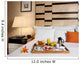 Tray with breakfast on a bed in a hotel room Wall Mural