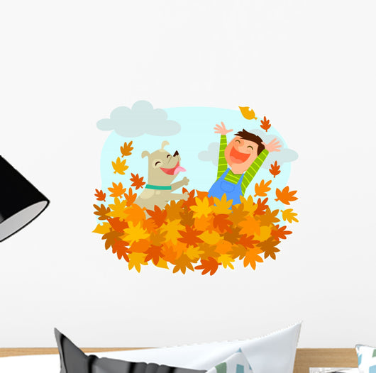 Boy and his dog playing in a pile of autumn leaves Wall Decal