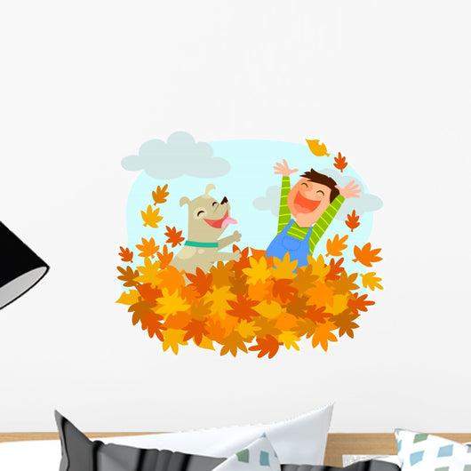 Boy and his dog playing in a pile of autumn leaves Wall Decal