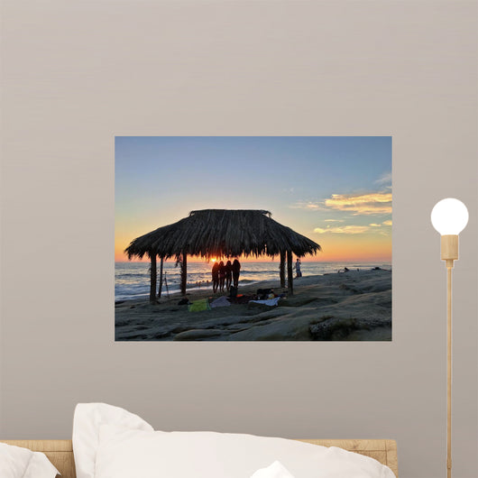 Silhouette of women under a beach shack in La Jolla, California.  Wall Mural