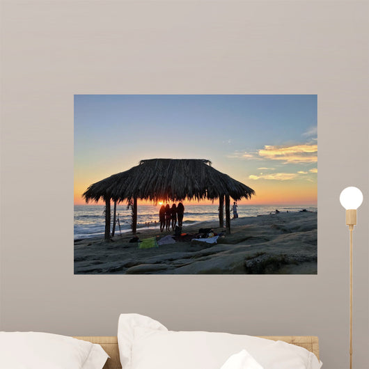 Silhouette of women under a beach shack in La Jolla, California.  Wall Mural