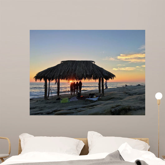 Silhouette of women under a beach shack in La Jolla, California.  Wall Mural